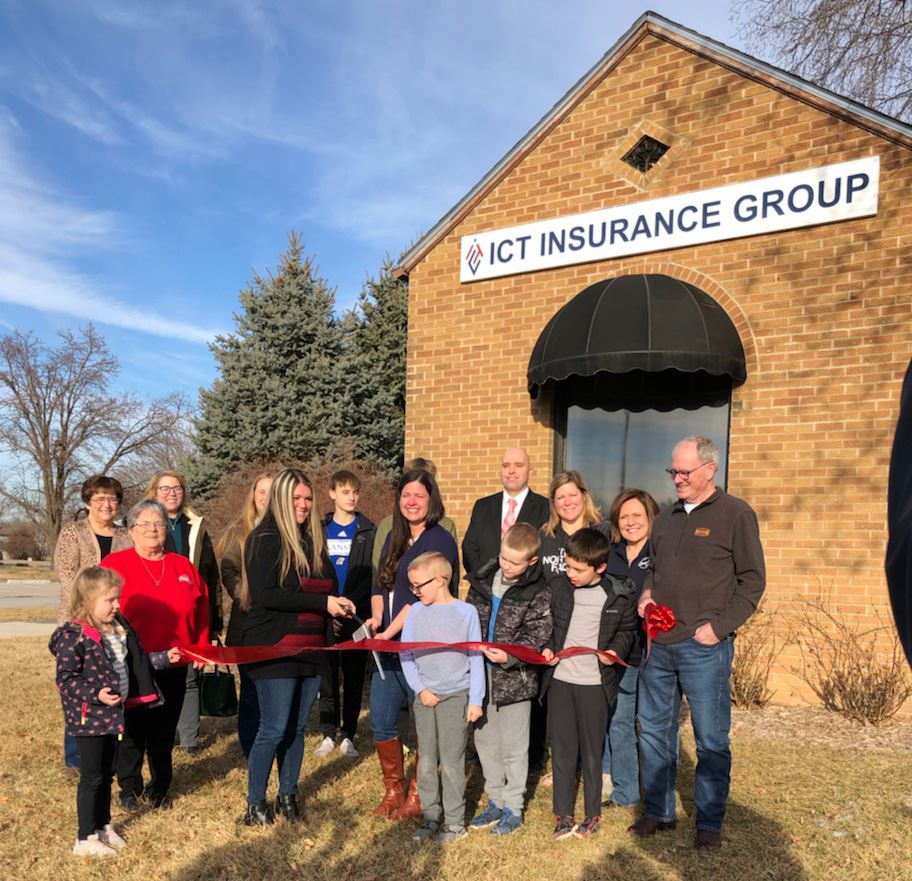 Group of People Holding a Ribbon